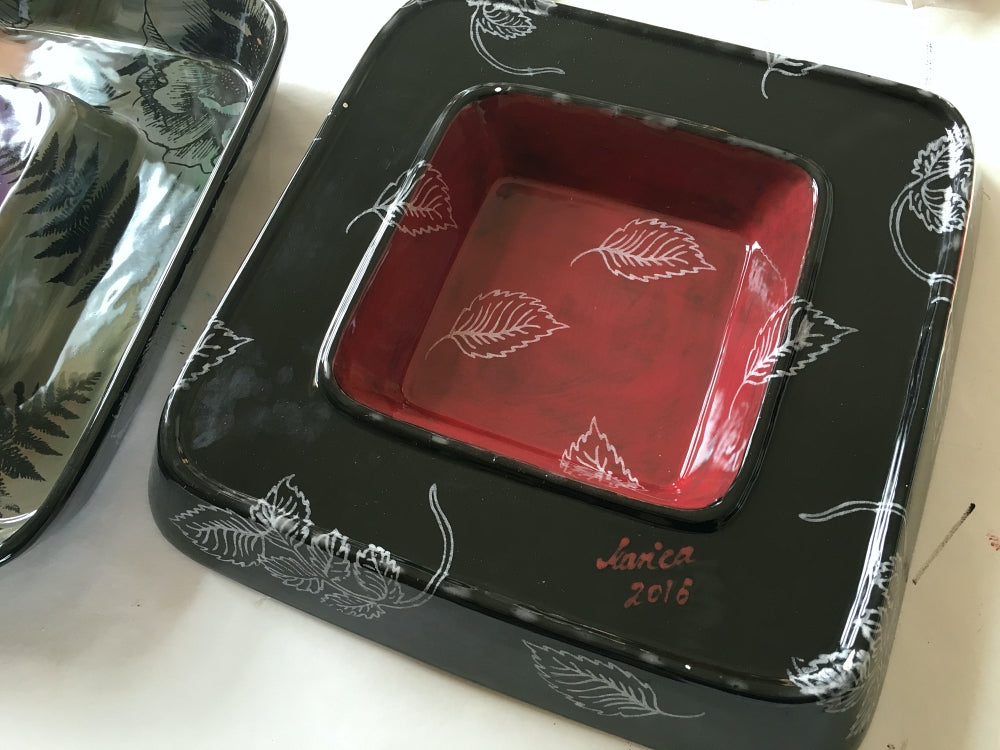 back detail of a pink and black flower pattern handprinted ceramic dish by Marianna Mills Hungarian artist