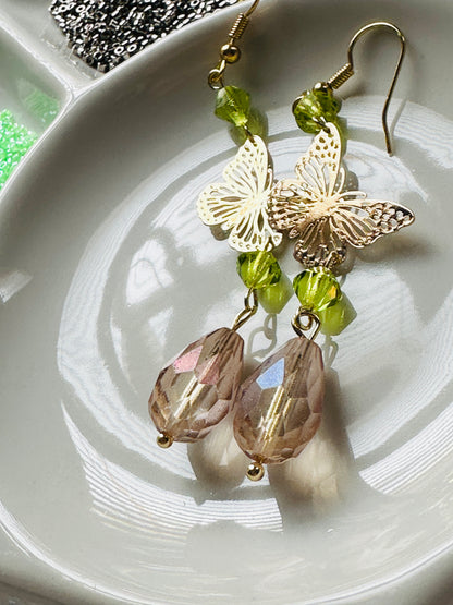 Handmade Butterfly chandelier dangle earrings with green and Antique lilac iridescent European glass crystal beads by Marianna Mills artist