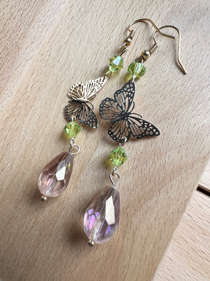 Handmade Butterfly chandelier dangle earrings with green and Antique lilac iridescent European glass crystal beads by Marianna Mills artist