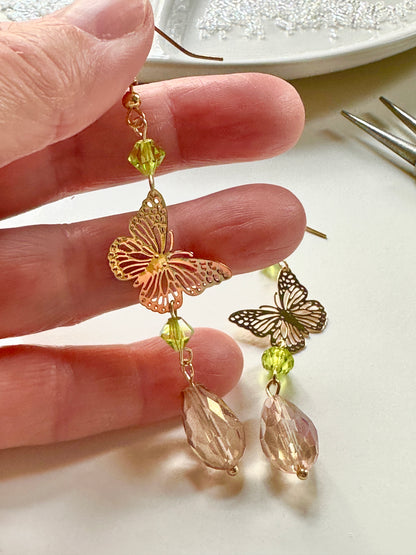 Handmade Butterfly chandelier dangle earrings with green and Antique lilac iridescent European glass crystal beads by Marianna Mills artist