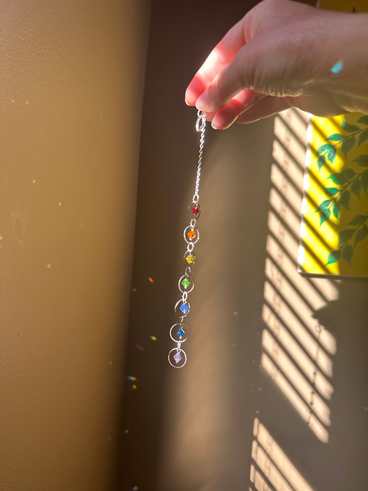 Mini Chakra Suncatcher

European Crystal glass Rainbow maker handmade by Marianna Mills artist.

Length 9 inches approx.