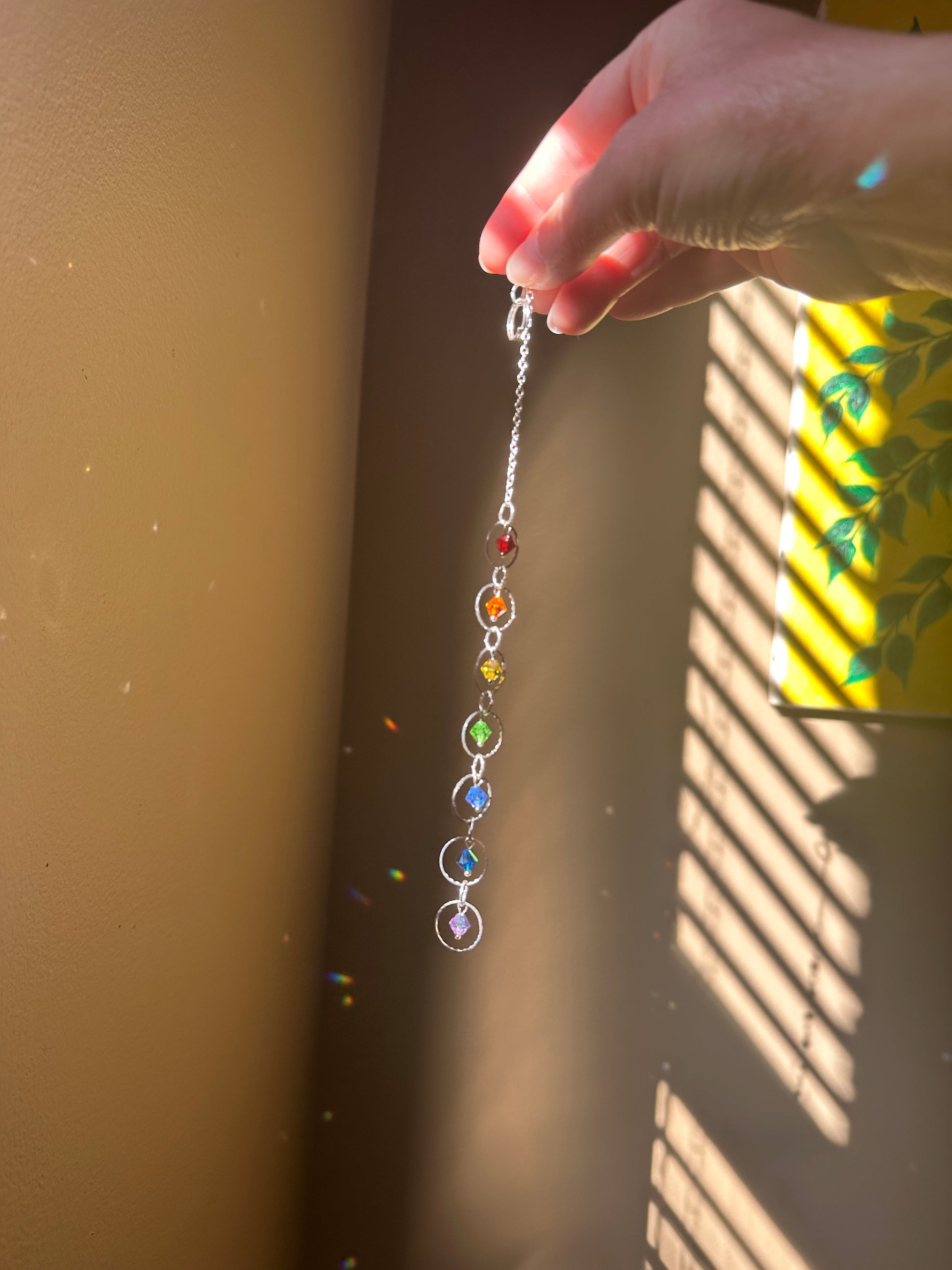 Mini Chakra Suncatcher

European Crystal glass Rainbow maker handmade by Marianna Mills artist.

Length 9 inches approx.