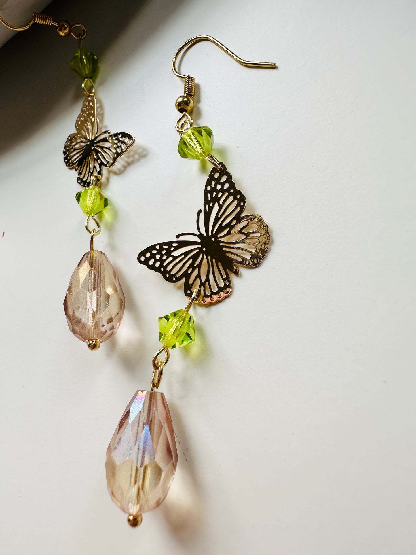 Handmade Butterfly chandelier dangle earrings with green and Antique lilac iridescent European glass crystal beads by Marianna Mills artist