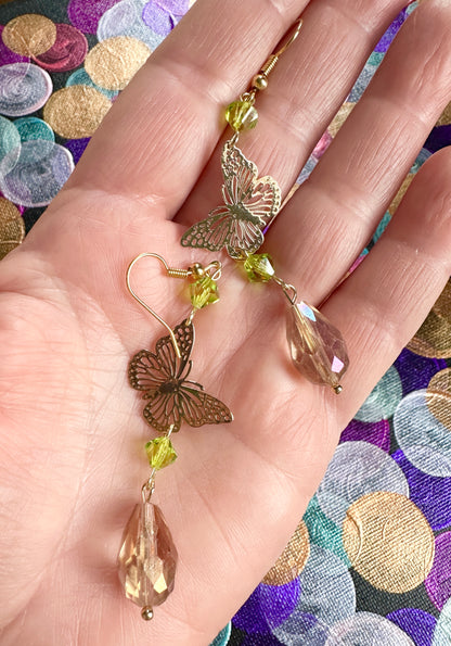 Handmade Butterfly chandelier dangle earrings with green and Antique lilac iridescent European glass crystal beads by Marianna Mills artist