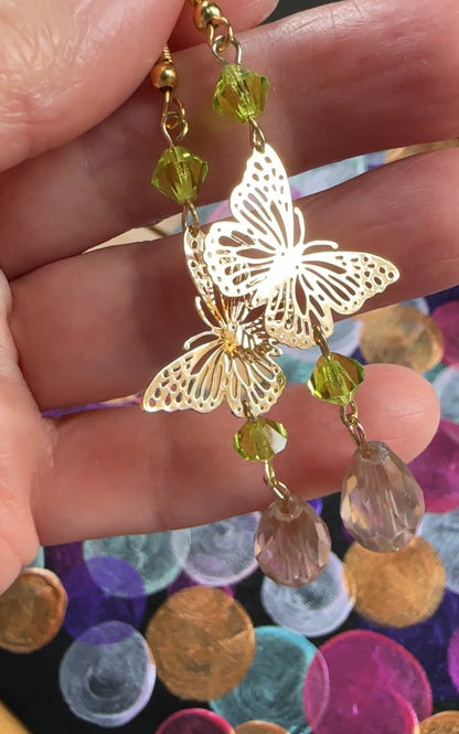 Handmade Butterfly chandelier dangle earrings with green and Antique lilac iridescent European glass crystal beads by Marianna Mills artist