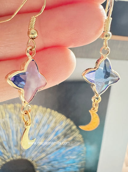 Celestial collection. One of a kind earrings, they can't be duplicated.  Designed and handmade by Marianna Mills.  Size: 2 inches  Blue glass star with metal outlining and natural brass moon shape drop.