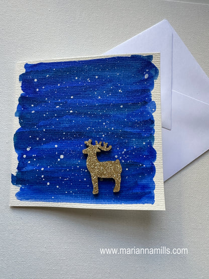 Hand painted Christmas Card #5 Snowy land with a glittery wood reindeer embellishment.