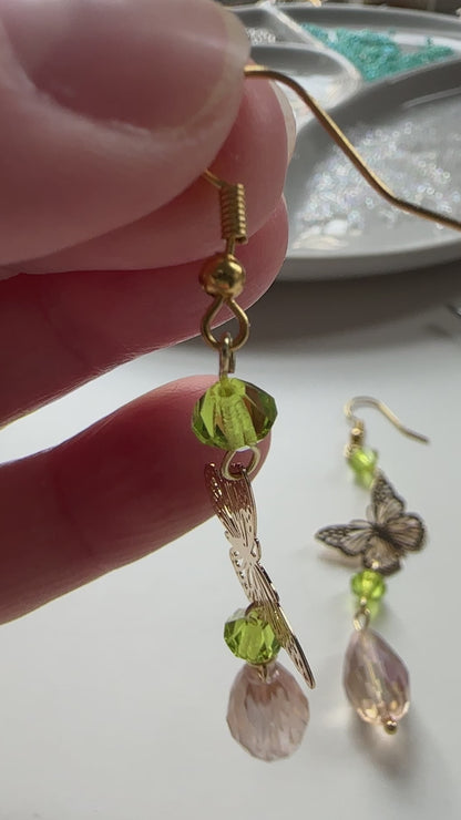 Handmade Butterfly chandelier dangle earrings with green and Antique lilac iridescent European glass crystal beads by Marianna Mills artist