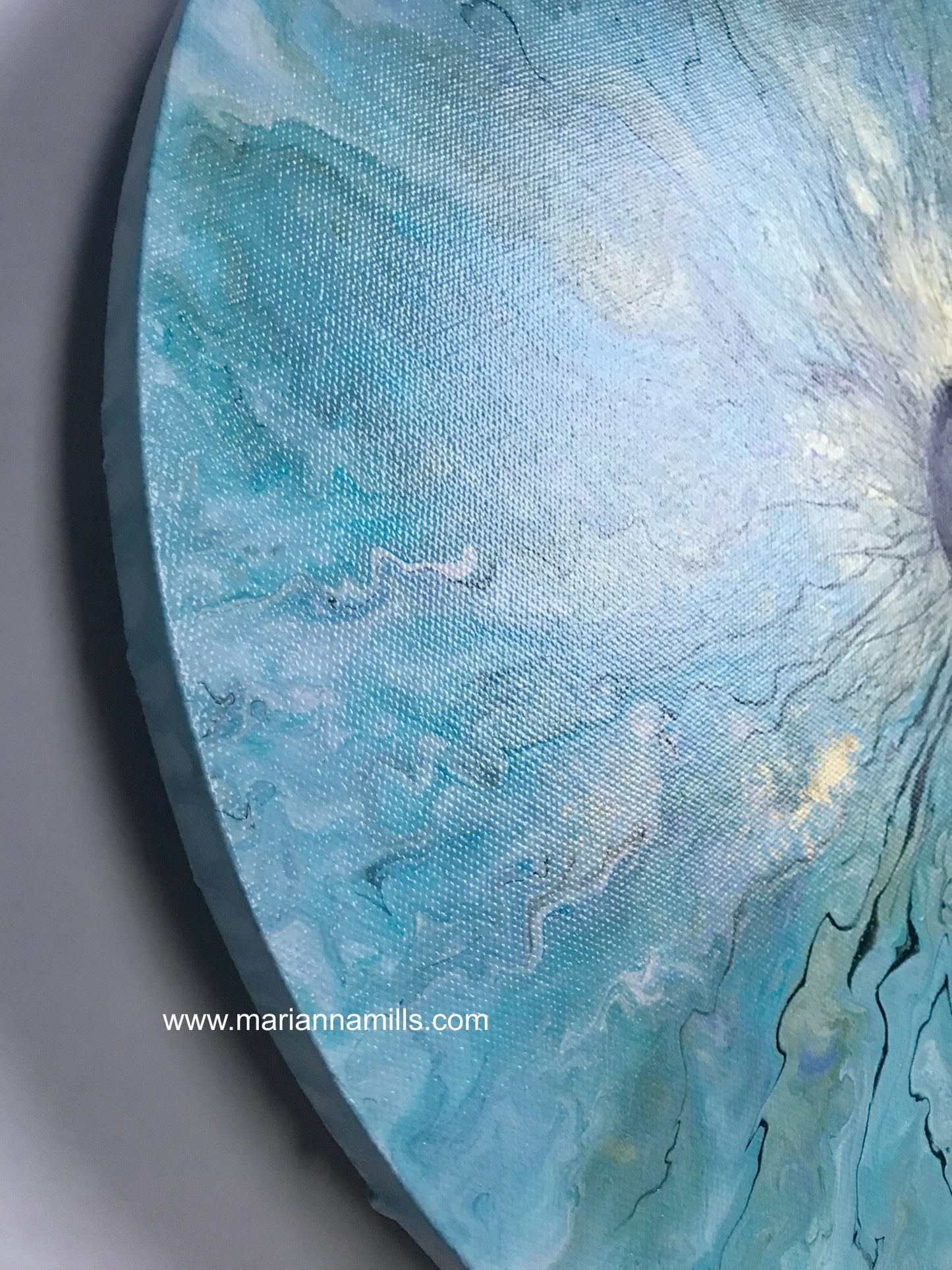 ocean eye - painting for sale by artist Marianna Mills. Acrylic fluid art on round canvas. Side shot of the gallery wrapped canvas, no need framing.