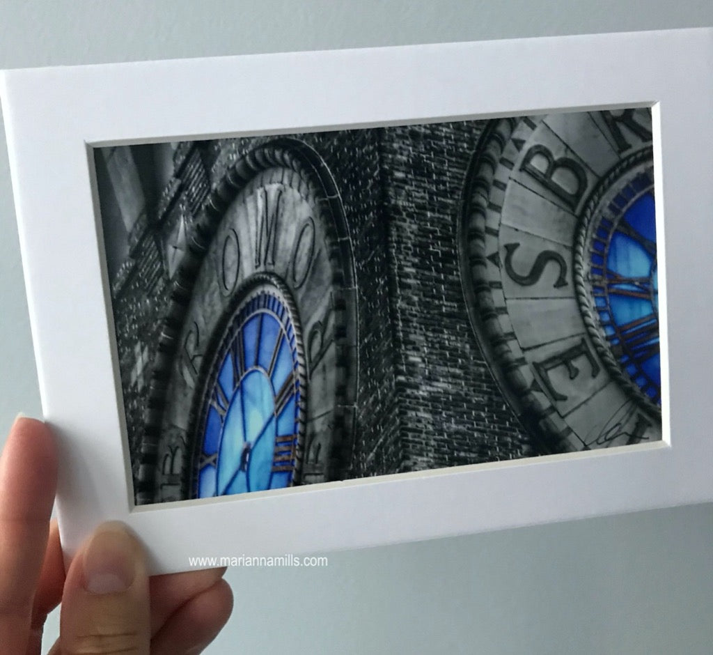 Matted art print by Marianna Mills of the Bromo Seltzer Tower blue clock in Baltimore, Maryland. detail photo of the clock faces with no hands 2015