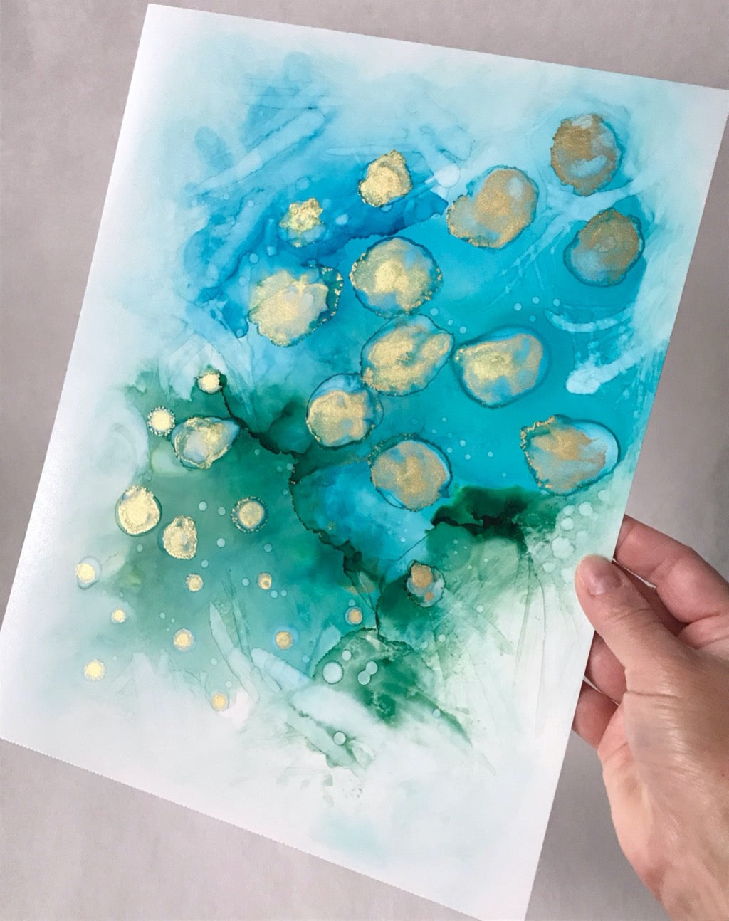 ocean 9"x12" alcohol ink painting by Marianna Mills. Blue, green and gold color inks.